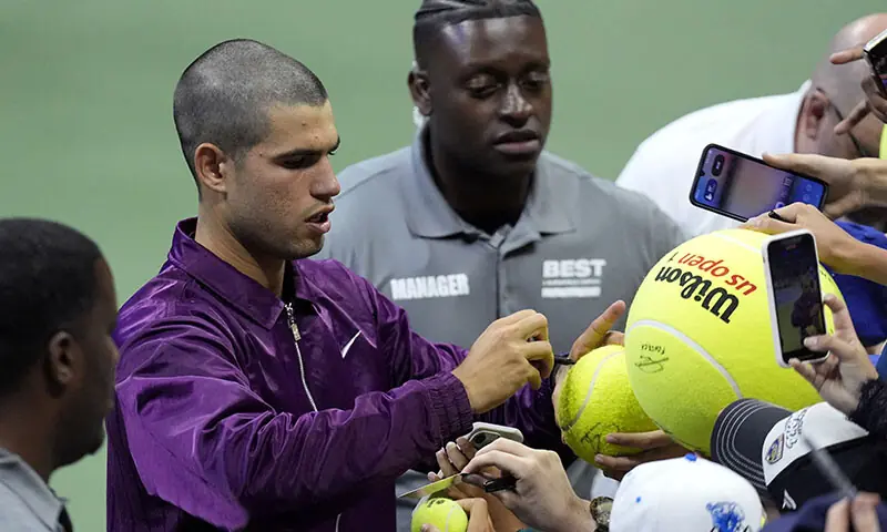 Carlos Alcaraz flaunts his new buzz cut during his first-round match at the 2025 US Open against Reilly Opelka at Flushing Meadows.